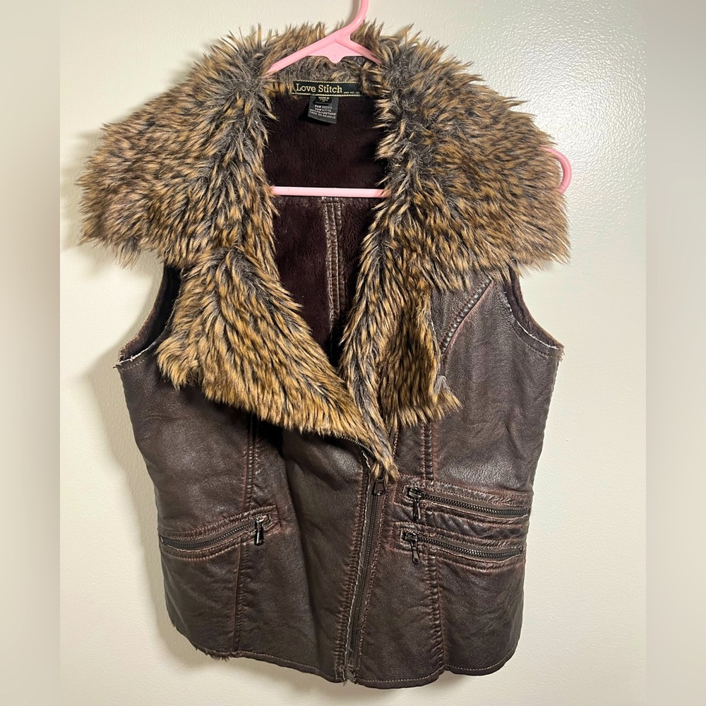 Pleather vest with faux fur collar.